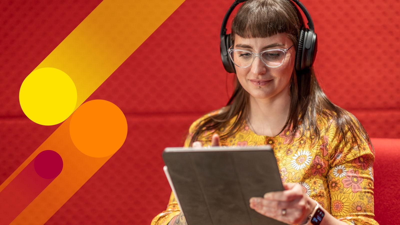 a woman looking at a tablet